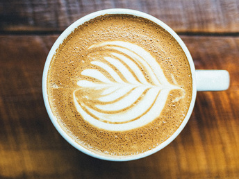 A close-up of a cafe latte from top