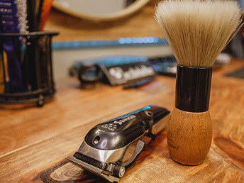 Close-up of clippers and shaving brush